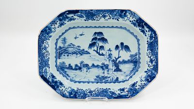 A large Chinese hexagonal shaped blue and white decorated dish. With nature scene of a figure 