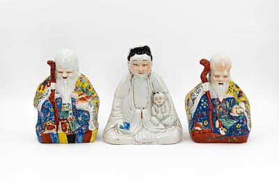 A lot of three Chinese Famille rose and blanc de chine decorated porcelain figures. A lot of 