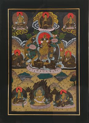 A Tibetan hand-painted thangka of multiple religious buddhas. Framed and glass protected 