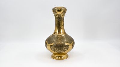 An antique oriental polished heavy bronze decorated bottle-shaped vase. Circa 1900. H: 34 cm