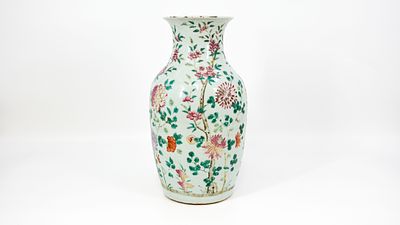 A Chinese Famille rose richly floral decorated porcelain vase. A Chinese famille rose richly 