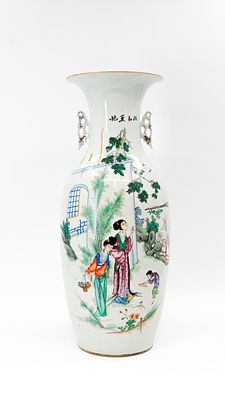 A Chinese Qianjiang and Famille rose decorated porcelain vase with the decor of two ladies in a 