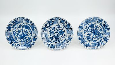 A lot of three Chinese Kangxi blue and white flora decorated plates. Marked, 18th century. 