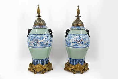 A matching lot of two Chinese porcelain vases, finely decorated in blue and white with 