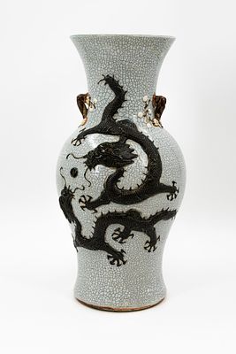 A Chinese crackled glazed vase decorated with a dragon in relief. Marked, 19/20th Century. 