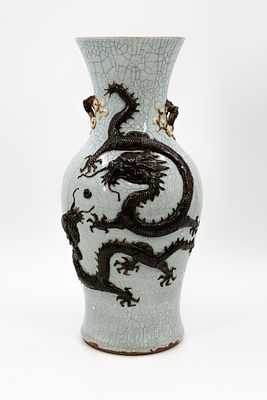 A Chinese crackled glazed vase decorated with a dragon in relief. Marked, 19/20th Century. 