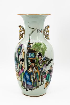 A Chinese Qianjiang and Famille Rose decorated porcelain vase with an animated garden scene. A 