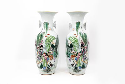 A pair of Chinese Famille Rose porcelain vases decorated with ladies and boys in the garden. 