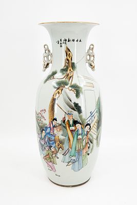 A Chinese Qianjiang and Famille Rose porcelain vase decorated with a scene of a family in the 