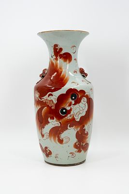 A Chinese Qianjiang-decorated porcelain vase with the decor of Fu-temple lions, with ringed red 