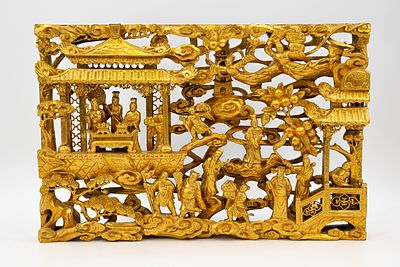 A Chinese gilt carved wooden wall plaque decorated with relief figures in a palace scene. 20th 