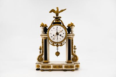 An antique French Louis XVI gilt bronze mounted marble mantel clock marked by Charles Le Roy. 