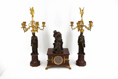 A French antique Louis XVI style gilt and figural patinated bronze and marble mantel clock set. A 