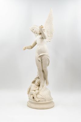 An antique carved white marble sculpture of a winged lady playing a violin with a resting child. 