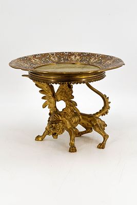 An antique figural gilt bronze and enamel tazza mounted with onyx marble and a dragon figure. 