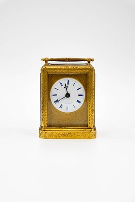 An antique finely decorated gilt brass carriage clock. Late 19th century. H: 14,5 cm