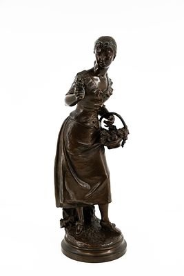 Henryk KOSSOWSKI (1855-1921) An antique patinated bronze sculpture representing a lady with a 