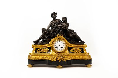A large antique French gilt and patinated bronze figural mantel clock with marble mounted 
