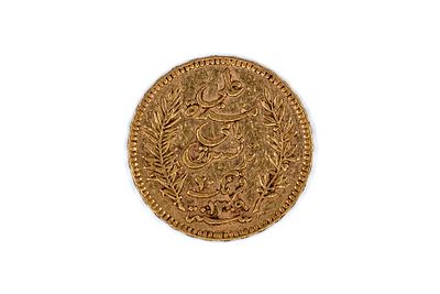 A Tunisian gold 20 Francs coin, dated 1892. With Arabic inscription within wreath on the 