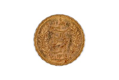 A Tunisian gold 20 Francs coin, dated 1901. With Arabic inscription within wreath on the 