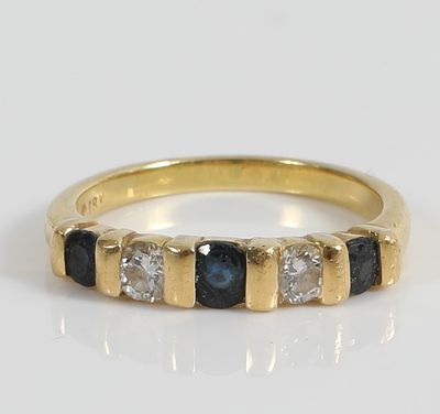 18K GOLD DIAMOND & SAPPHIRE BAND. Yellow gold, set with (2) .15 carat round diamonds, (3) .10 