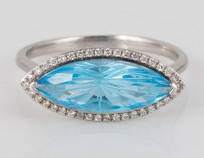 14K WHITE GOLD BLUE TOPAZ RING. White gold ring set with horizontal faceted marquise blue topaz 