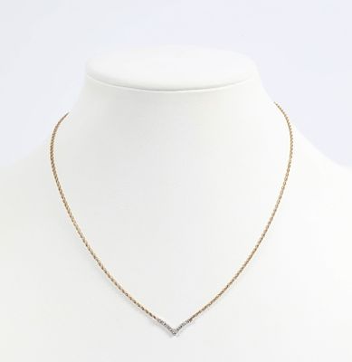 14K GOLD & DIAMOND NECKLACE. Yellow gold with "V" drop; set with (9) .03 carat +/- round 