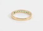 GOLD & STONE BAND. 14K yellow gold band with (9) round green stones; [1.55 dwt total]; size 8 3/4, VGImage - 1