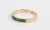 GOLD & STONE BAND. 14K yellow gold band with (9) round green stones; [1.55 dwt total]; size 8 3/4, VGImage - 3