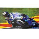 A stranger - Poster signed by Movistar team rider Alberto Puig #9. Framed poster of rider Alberto 