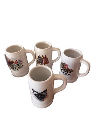 Set of 4 Collectible Mini Mugs. Set of four small cups made of glossy white porcelain. Each one 