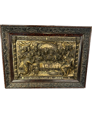 Antique painting with relief of The Last Supper of Jesus. A sacred relief artwork depicting the 