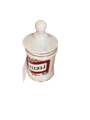 Antique white porcelain apothecary jar or pharmacy bottle with the inscription ALKALI and 