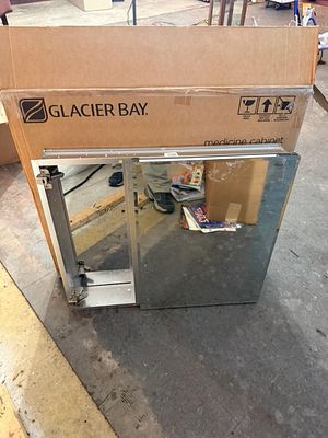 Glacier Bay Mirrored Single Door Medicine Cabinet. This item is a single-door mirrored medicine 
