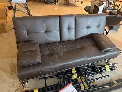 Contemporary Faux Leather Convertible Futon Sofa with Pillows. This contemporary dark brown faux 