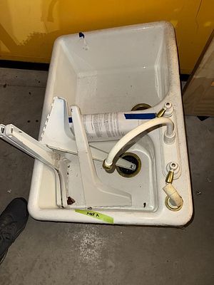 Vintage White Porcelain Enameled Cast Iron Double-Basin Sink with Bridge Faucet. A vintage-style 