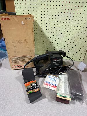 An Assortment of a Sears Craftsman 1 HP 3x21 Inch Belt Sander with Original Box and Sanding 