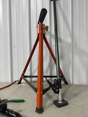 Two Utility Workshop Tools including a Tripod Outfeed Stand and a Telescopic Ratcheting load bar. 