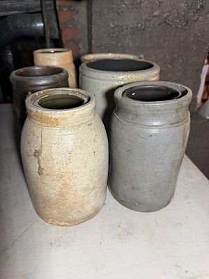 A Collection of American Utilitarian Stoneware Storage Jars and a Crock, 1/2 to 1 gallon, some 