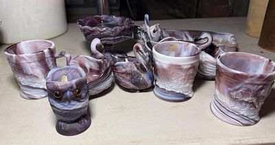A 11 Piece Collection of Purple Slag Glass Attributed to Imperial Glass Company, most marked 