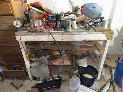 An Assortment of Workshop Tools, Household Supplies, and Decorative Items, Workbench included. A 