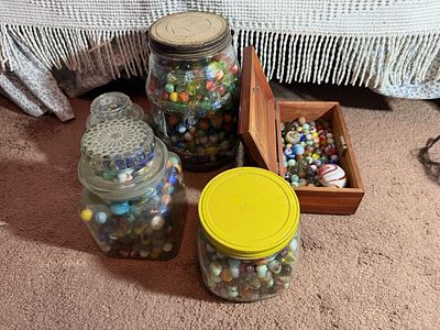 A Collection of Vintage Glass Marbles in Decorative Jars and a Miniature Cedar Chest. This lot 
