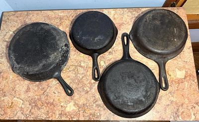 A Collection of Vintage American Cast Iron Skillets and Grill Pan, size 5,6, and 2- 8's. Auction 
