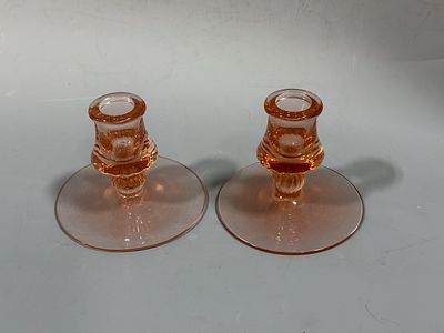 A Pair of Pink Depression Glass Candlesticks. A pair of transparent pink depression glass 