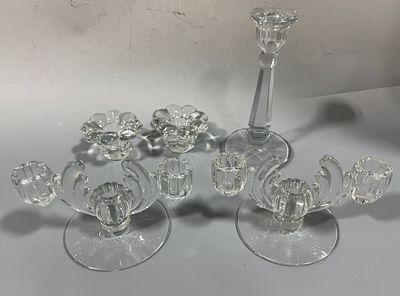 A Collection of Five Clear Glass Candle Holders Including Pieces Attributed to Heisey. This 