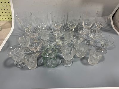 An Assortment of 25 Pieces of Vintage Clear and Tinted Pressed Glassware, some appears to be 