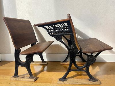 A Pair of Antique Columbia School Supply Co. Cast Iron and Oak Desks. This lot consists of two 