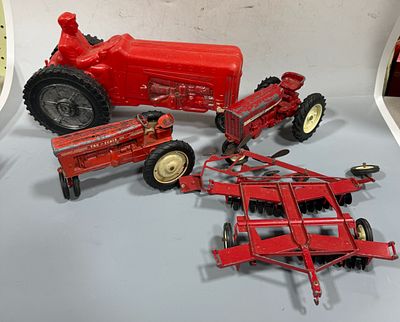 A Collection of Vintage Die-Cast and Plastic Toy Tractors and Farm Implements including 