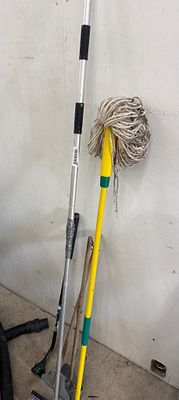An Assortment of Household and Garden Tools Including a DocaPole Mop and Homeowner Spade