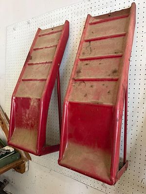 A Pair of Red Steel Automotive Ramps